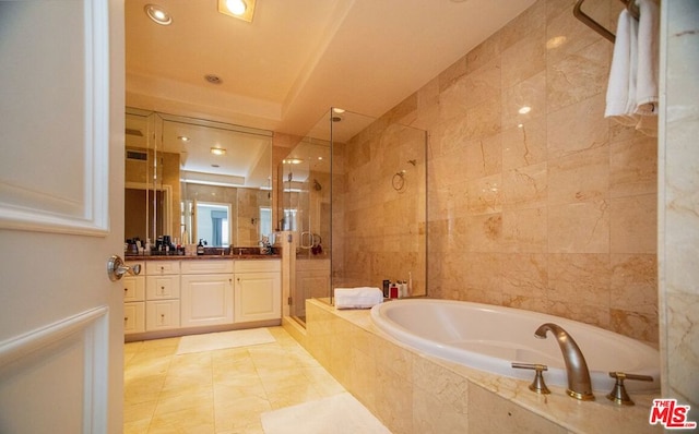 bathroom featuring vanity, shower with separate bathtub, and tile patterned flooring