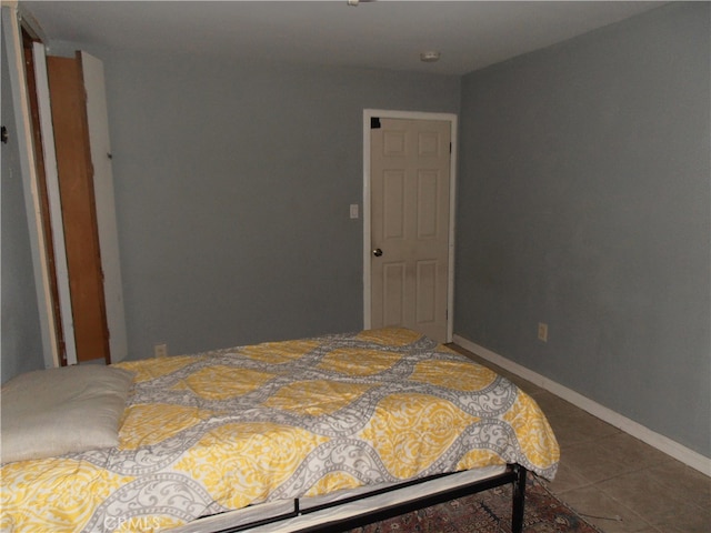 bedroom featuring tile patterned floors