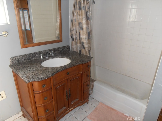 bathroom with tile patterned flooring, vanity, and shower / bath combo with shower curtain