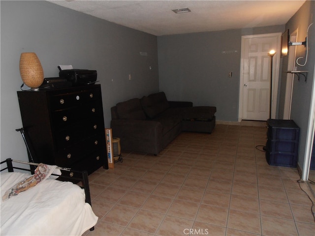 bedroom featuring light tile patterned flooring