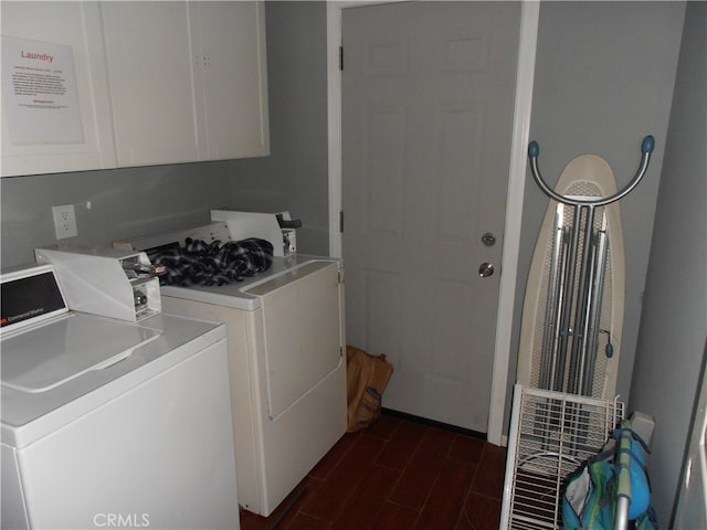 laundry area featuring dark hardwood / wood-style floors and independent washer and dryer