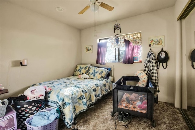 bedroom featuring carpet, ceiling fan, and a closet