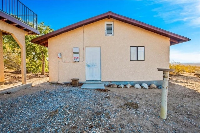 5975 Desert Star Rd Unit 1-2, Johnson Valley, CA 92285 - back of house featuring stucco siding