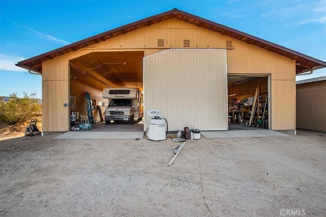 view of outbuilding with a carport