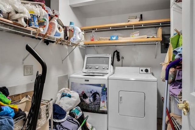 washroom with washing machine and clothes dryer