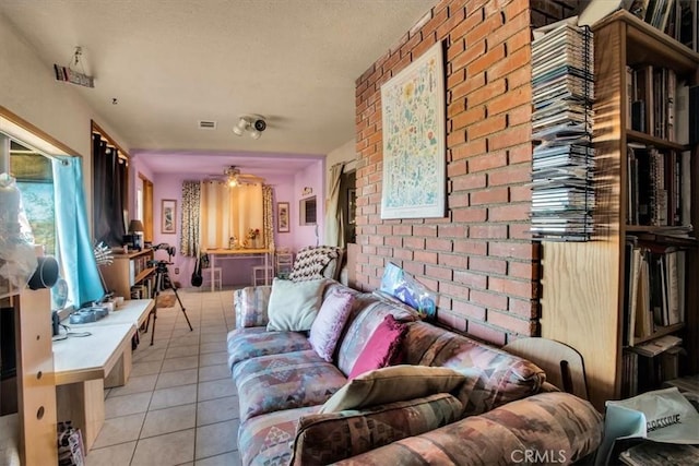 5975 Desert Star Rd Unit 1-2, Johnson Valley, CA 92285 - living room featuring a textured ceiling, visible vents, and light tile patterned floors