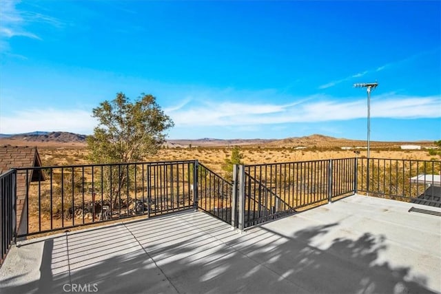 5975 Desert Star Rd Unit 1-2, Johnson Valley, CA 92285 - wooden deck featuring a mountain view