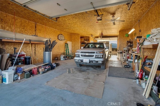 garage with ceiling fan and a garage door opener