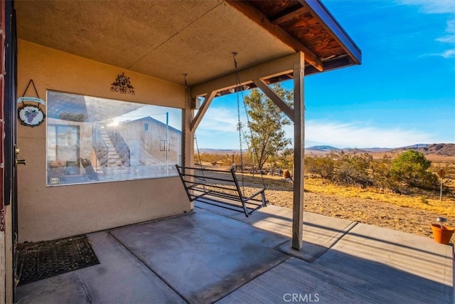 view of patio / terrace with a mountain view