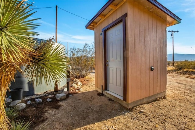 view of outbuilding with a mountain view