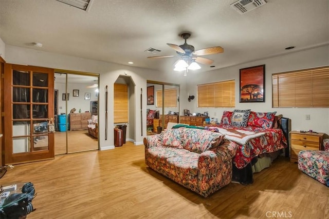 5975 Desert Star Rd Unit 1-2, Johnson Valley, CA 92285 - bedroom with multiple closets, visible vents, and light wood-type flooring
