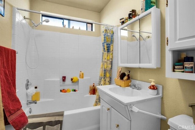 5975 Desert Star Rd Unit 1-2, Johnson Valley, CA 92285 - full bathroom with vanity, toilet, and shower / tub combo with curtain