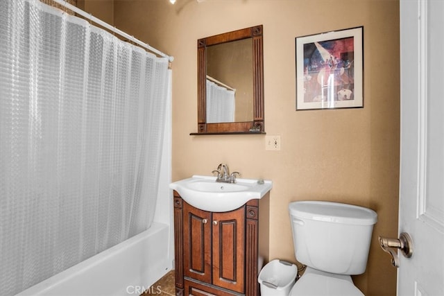 full bathroom with vanity, shower / tub combo, and toilet