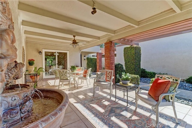 view of patio featuring ceiling fan