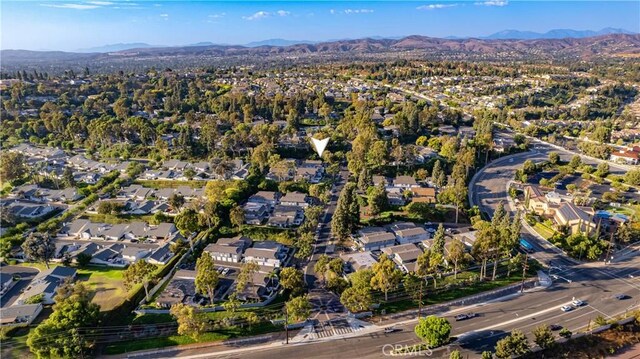 birds eye view of property with a mountain view