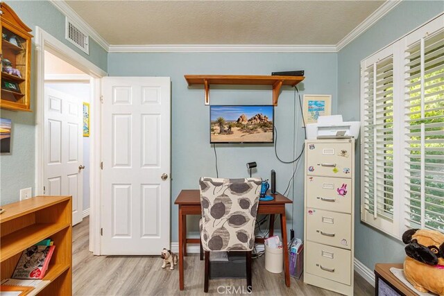 interior space with crown molding, light hardwood / wood-style floors, and a textured ceiling