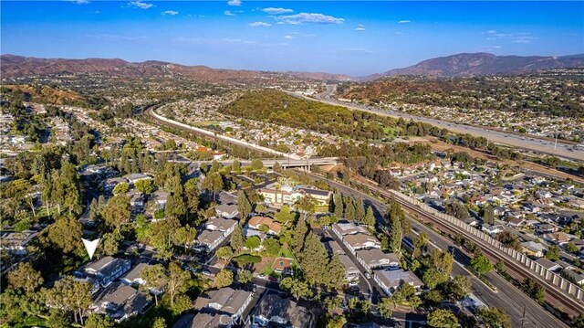 birds eye view of property featuring a mountain view