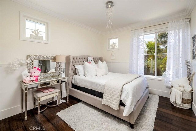 bedroom featuring ornamental molding and dark hardwood / wood-style floors