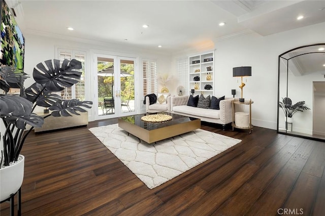 living room featuring dark wood-type flooring, crown molding, and french doors