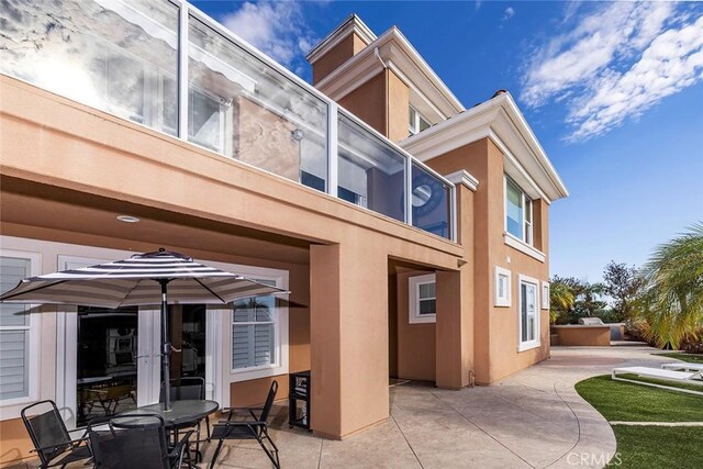 back of house featuring a patio