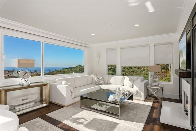 sunroom featuring a water view