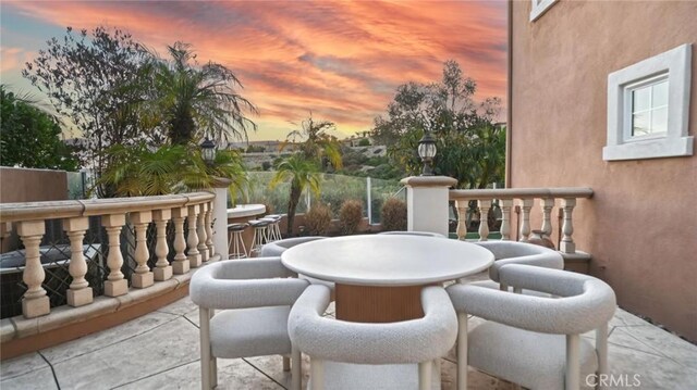 view of balcony at dusk