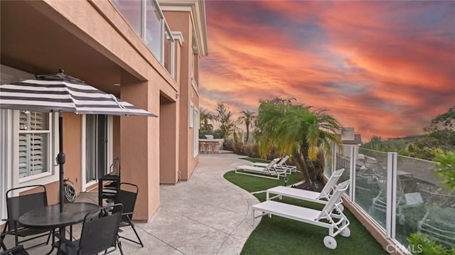 view of patio terrace at dusk