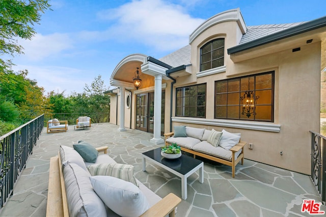 view of patio / terrace featuring outdoor lounge area and a balcony