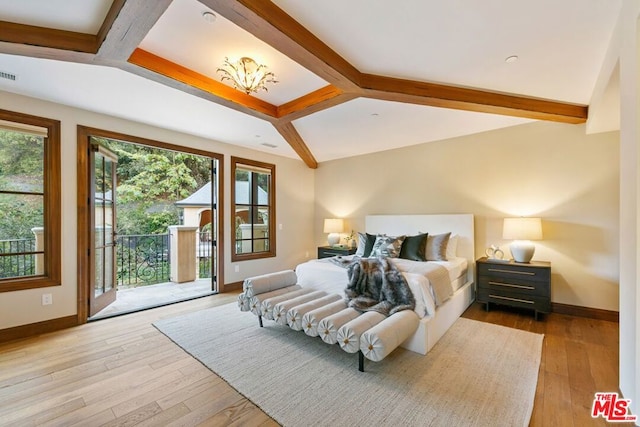 bedroom featuring beam ceiling, light wood-type flooring, and access to outside