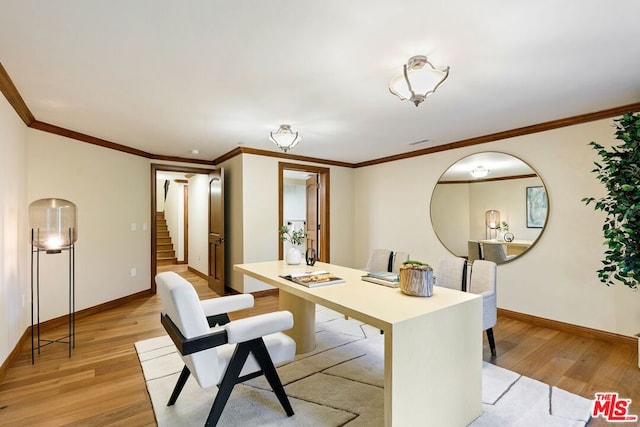 office space with light wood-type flooring and crown molding