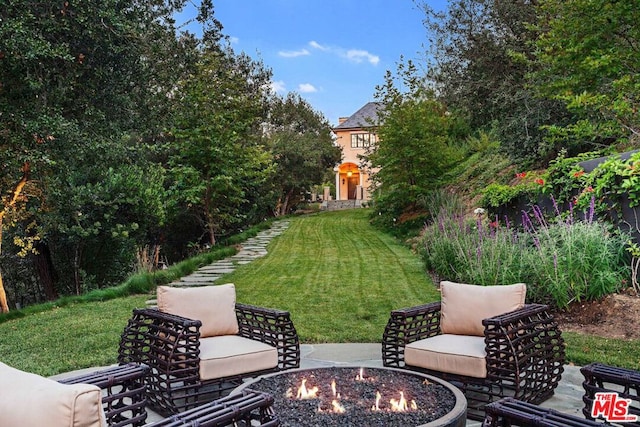 view of yard with a patio area and an outdoor fire pit