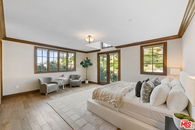 bedroom featuring access to exterior, french doors, light hardwood / wood-style floors, and ornamental molding