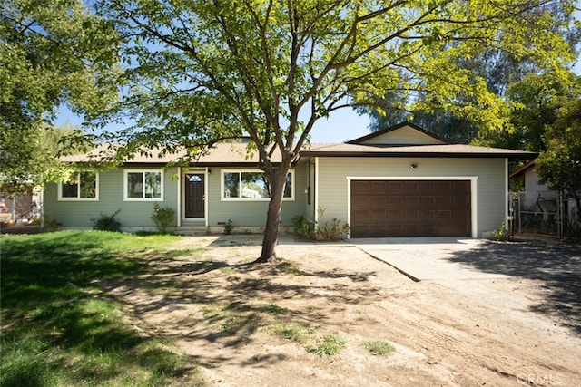 ranch-style home featuring a garage