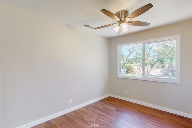 unfurnished room featuring ceiling fan and hardwood / wood-style floors