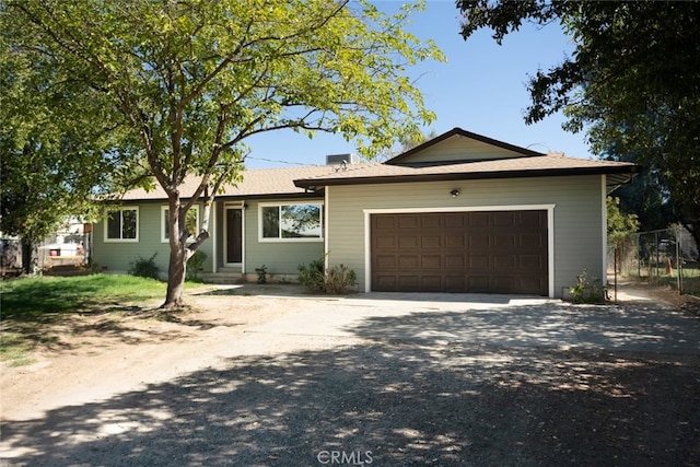 single story home featuring a garage