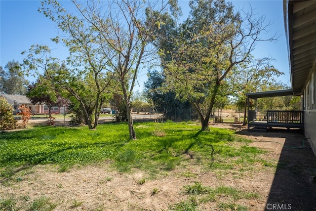 view of yard with a wooden deck