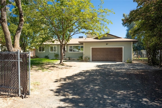 ranch-style house featuring a garage