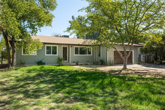 ranch-style home featuring a garage and a front yard