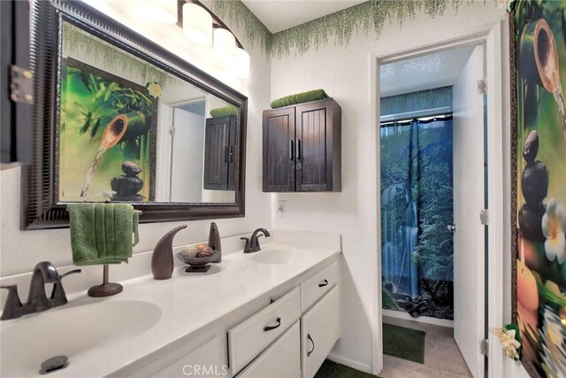 bathroom featuring tile patterned floors, vanity, and a shower with shower curtain