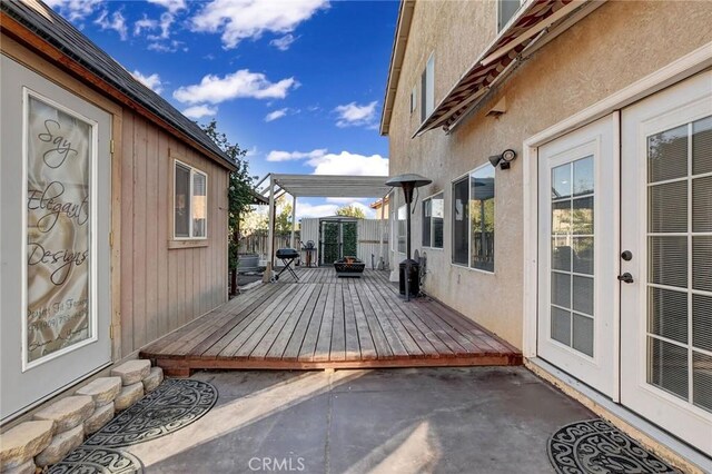 wooden deck featuring french doors