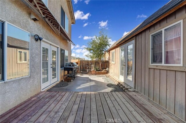 deck featuring a patio area and french doors