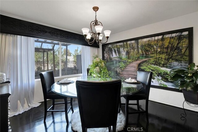 dining space with a notable chandelier