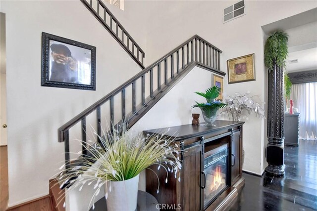 stairway with hardwood / wood-style floors