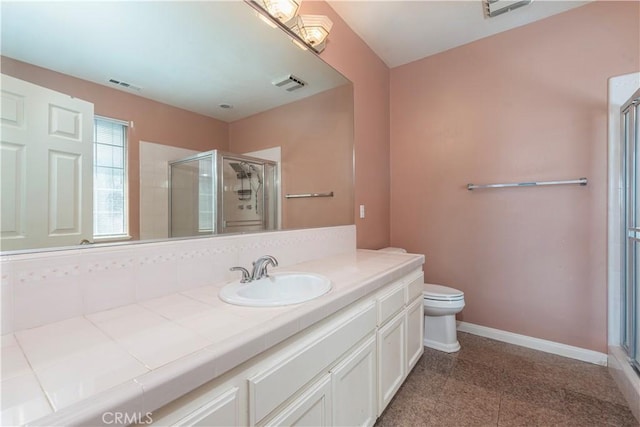 bathroom with toilet, an enclosed shower, and vanity