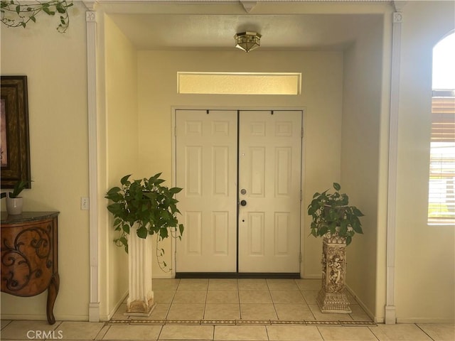 entrance foyer featuring light tile patterned floors