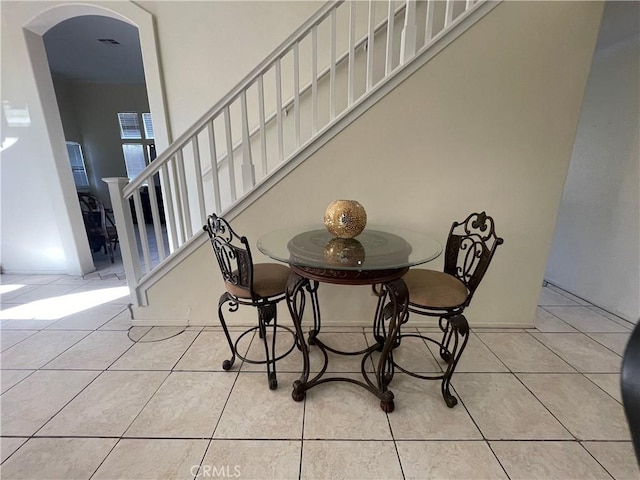 dining area featuring light tile patterned floors