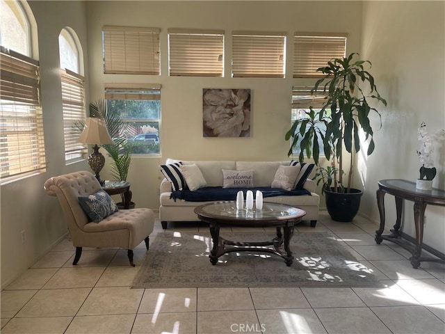 tiled living room with plenty of natural light