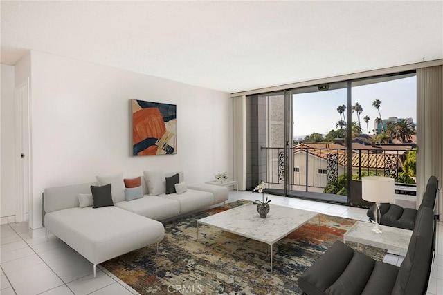 tiled living room featuring a wall of windows