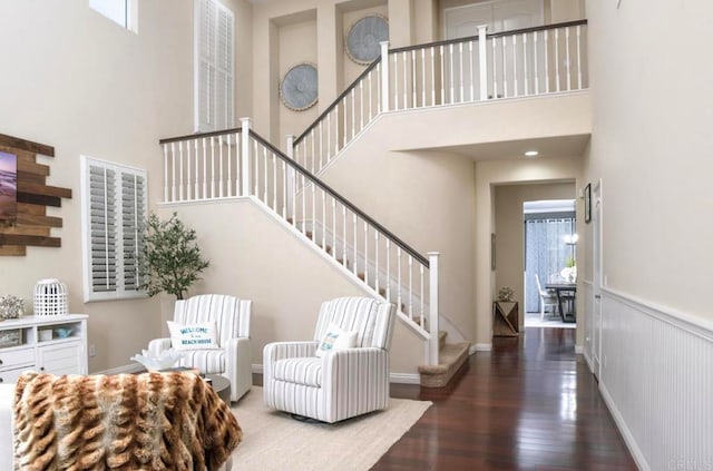 entrance foyer with a high ceiling and dark hardwood / wood-style floors