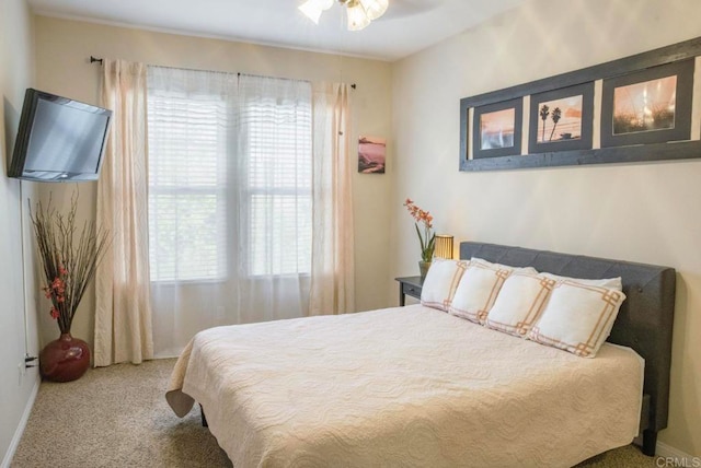 bedroom with ceiling fan and carpet floors